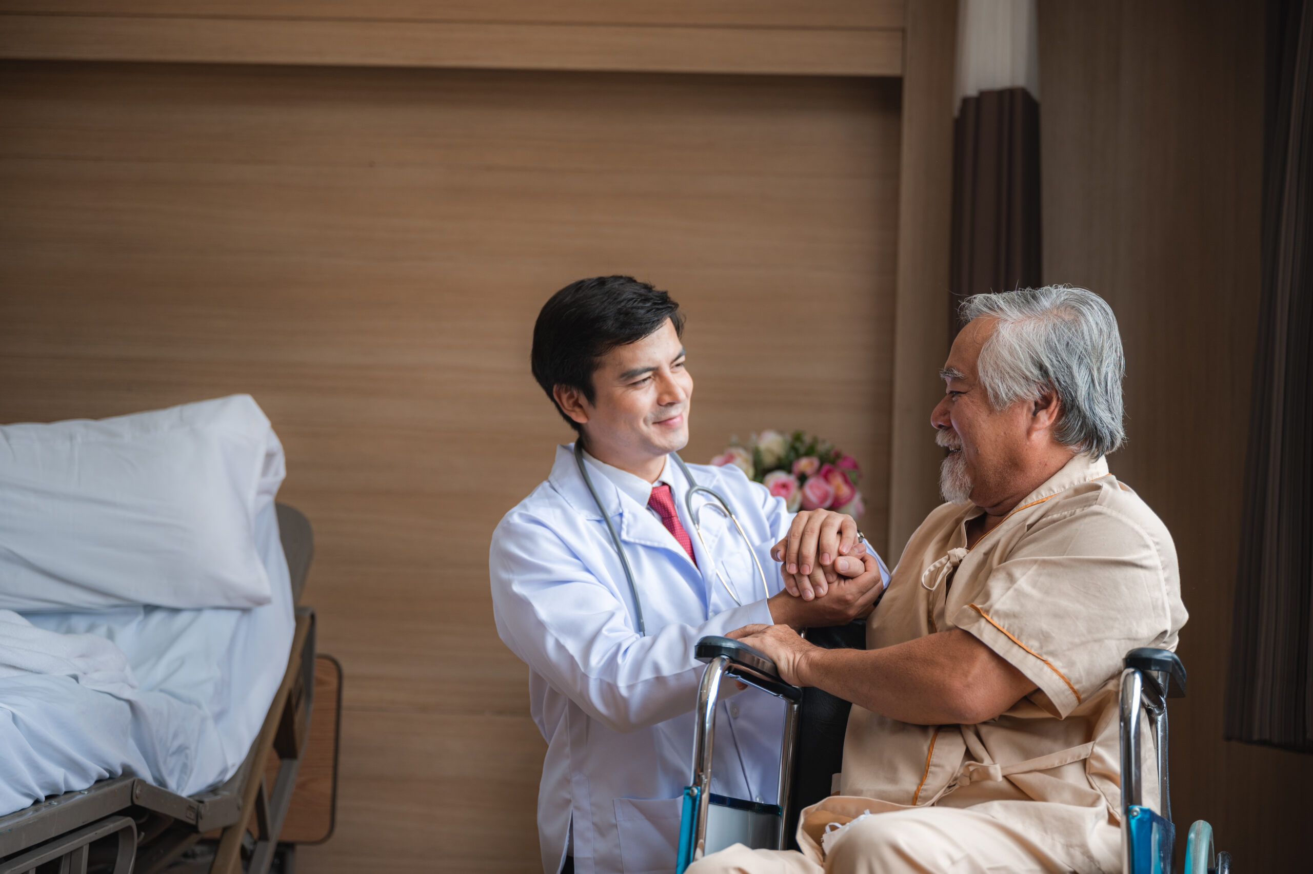 Senior male patient waiting patiently for doctor on exam room. Older man going regular appointment for annual health check up, Medical staff taking and caregiver senior man, health insurance concept Affinity Health Guide to Senior Care Options in Canada